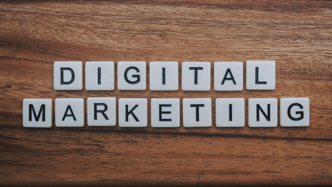A laptop showing a digital marketing blog draft beside strategy notes